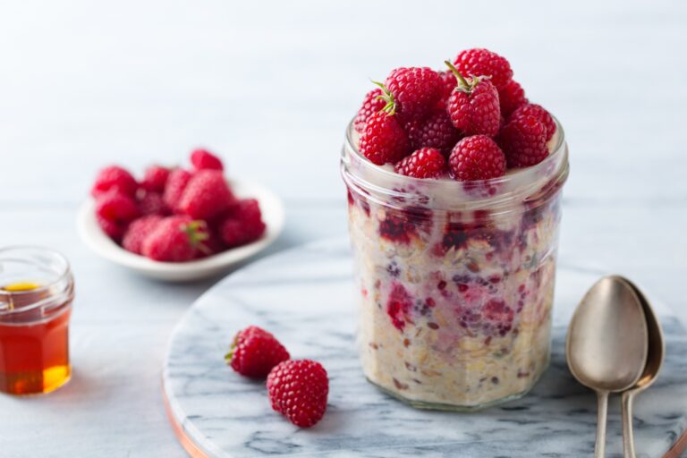 Overnight oats in a mason jar with berries, to illustrate overnight oat recipes