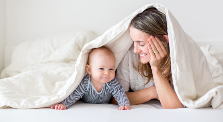mother and child under the covers