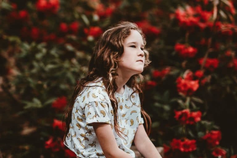 girl sitting and looking into the distance