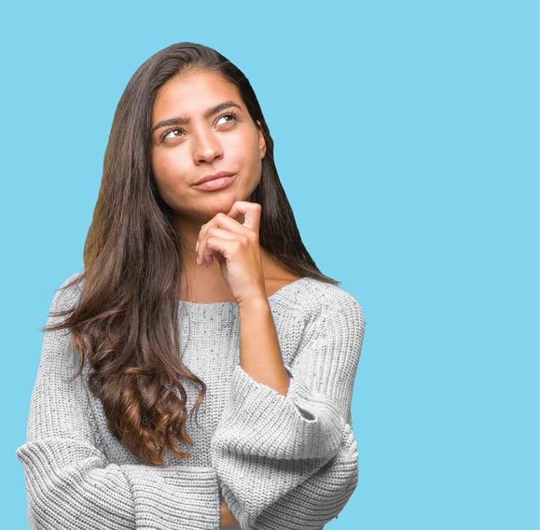 Woman with her hand on her chin, to illustrate re-thinking work-life balance
