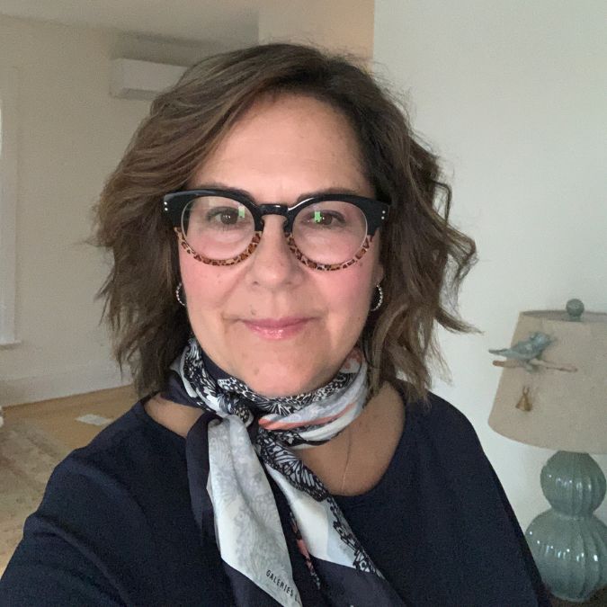 Cookbook review writer Bonnie Young wears glasses and a jaunty scarf