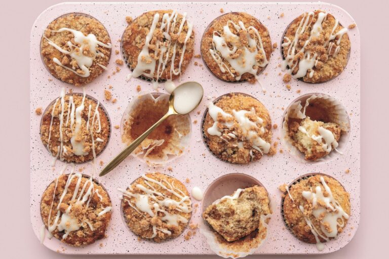 Tray of coffee cake swirl muffins with icing drizzle