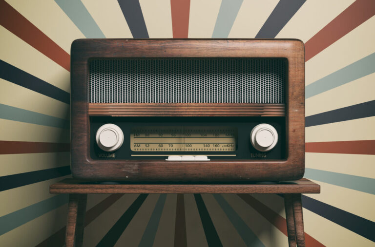 Vintage radio on a starburst background for old-time radio shows for families