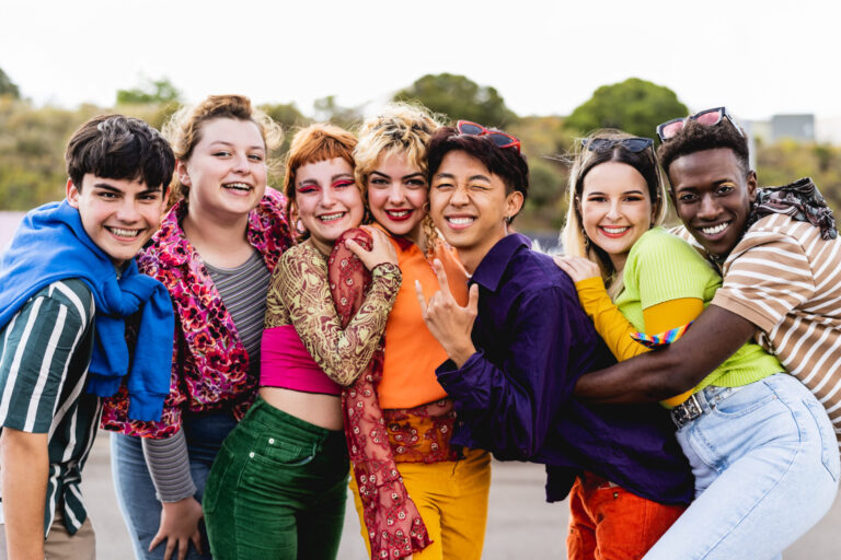 Group of smiling diverse youth to mark International Day Against Homophobia, Biphobia and Transphobia
