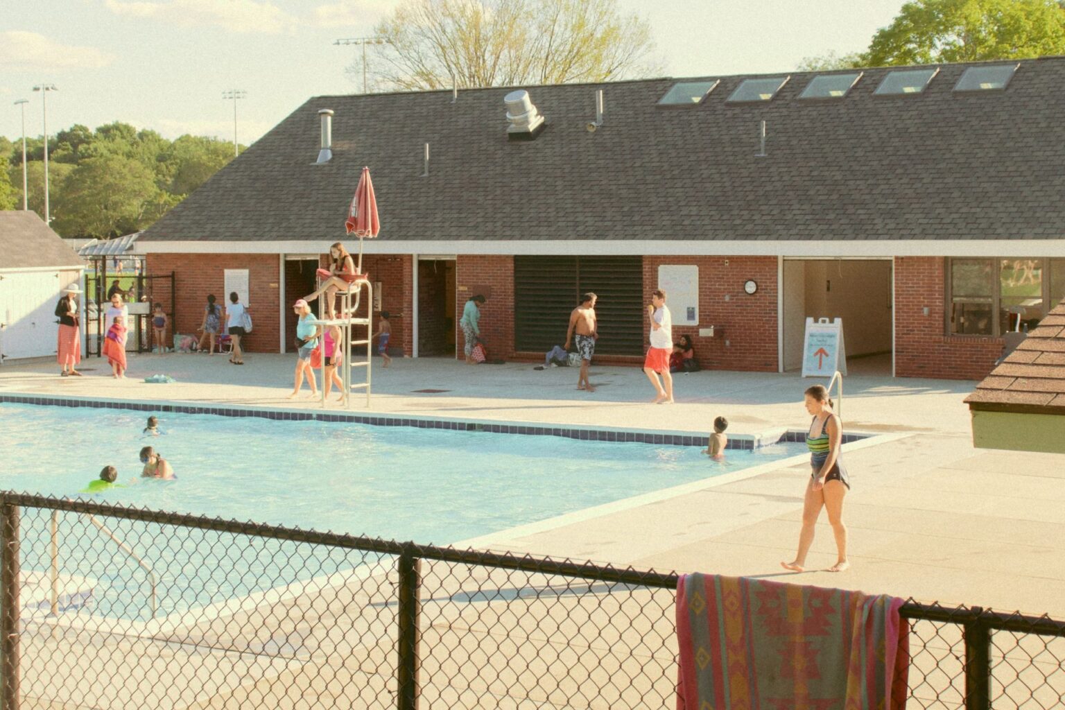 people at a public pool during a heat wave